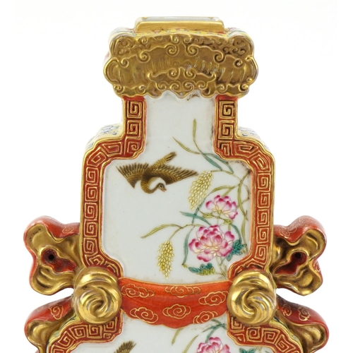 227 - A Chinese Canton porcelain vase with iron red handles finely hand painted in the famille rose palett... 