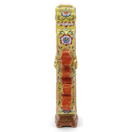 227 - A Chinese Canton porcelain vase with iron red handles finely hand painted in the famille rose palett... 