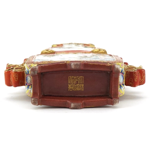 227 - A Chinese Canton porcelain vase with iron red handles finely hand painted in the famille rose palett... 