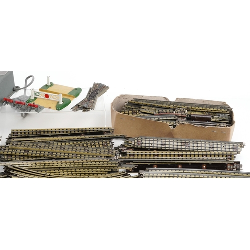 1052 - A large collection of vintage Hornby OO gauge tinplate model railway track, switches and two control... 