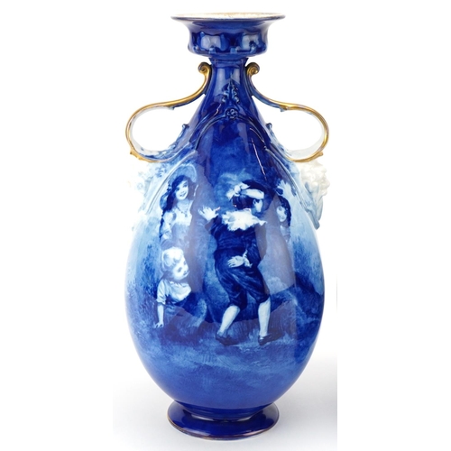 99 - A pair of Royal Doulton Blue Children series ware vases with twin grotesque mask handles, 29.5cm hig... 