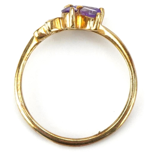 3671 - A 9ct gold amethyst and diamond floral dress ring, size N, 1.9g.