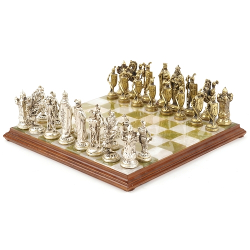 1038 - A Forma cast metal chess set, the king 8.5cm high, together with an onyx and alabaster chequer board... 