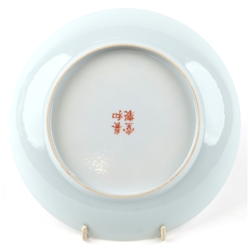 170 - A Chinese porcelain shallow dish hand painted with three figures, iron red character marks to the ba... 