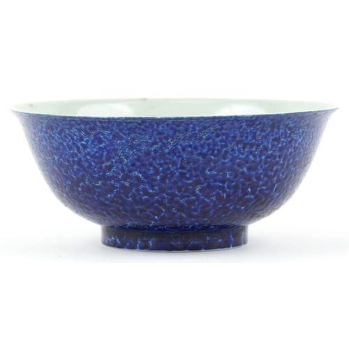 167 - A Chinese porcelain bowl having a mottled blue glaze and hand painted dragons chasing a flaming pear... 