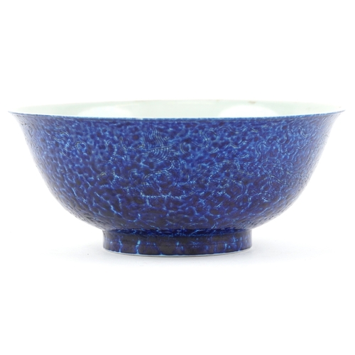 167 - A Chinese porcelain bowl having a mottled blue glaze and hand painted dragons chasing a flaming pear... 