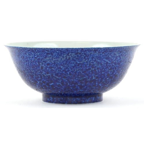 167 - A Chinese porcelain bowl having a mottled blue glaze and hand painted dragons chasing a flaming pear... 