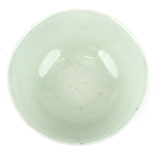 167 - A Chinese porcelain bowl having a mottled blue glaze and hand painted dragons chasing a flaming pear... 