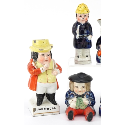 210 - Six Victorian Staffordshire pottery figures comprising three condiment pots and covers, a Toby milk ... 
