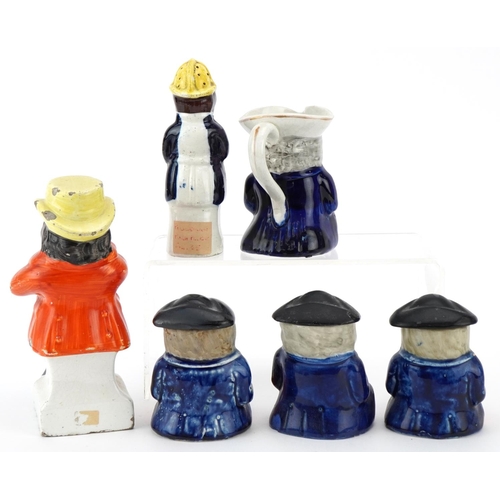 210 - Six Victorian Staffordshire pottery figures comprising three condiment pots and covers, a Toby milk ... 