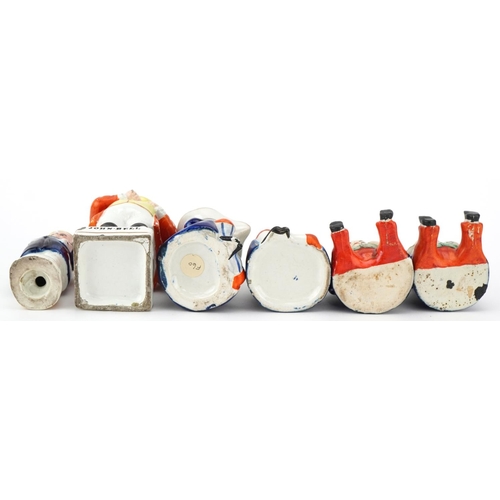 210 - Six Victorian Staffordshire pottery figures comprising three condiment pots and covers, a Toby milk ... 