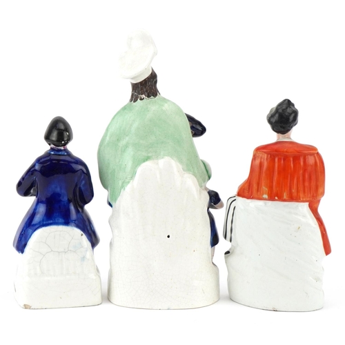 203 - Three Victorian Staffordshire pottery flatback figures comprising two Robbie Burns and a William Tel... 