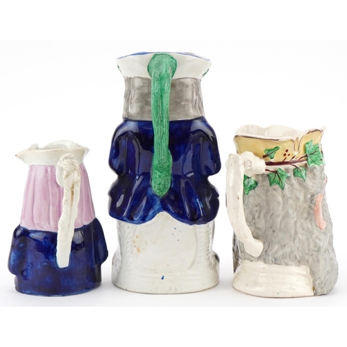 215 - A Victorian Staffordshire pottery Toby Jug 'Merry Christmas' , a Greek Bacchus Toby jug and a Home B... 