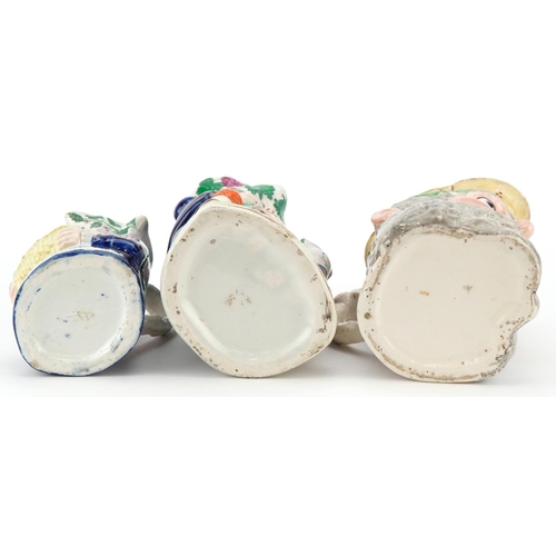 215 - A Victorian Staffordshire pottery Toby Jug 'Merry Christmas' , a Greek Bacchus Toby jug and a Home B... 