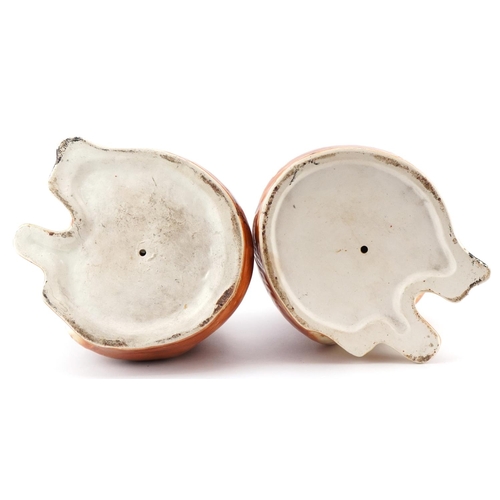 220 - A pair of large Staffordshire pottery cats with glass eyes, 32cm high.