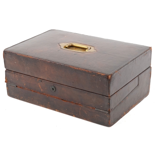A 19th century brown leather writing slope, the recessed brass handle engraved 'The Honourable Robert Wellington Stapleton-Cotton' the 3rd Viscount Combermere (1845-1898), the hinged top revealing a dark blue leather interior, writing surface and inkwell with a Bramah lock, 17cm H x 41cm W x 28cm D.