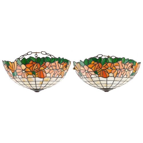 A pair of Tiffany style leaded glass light shades, 43cm in diameter.