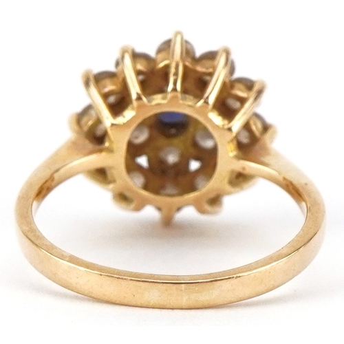 3031 - An 18ct gold sapphire and clear stone three tier cluster ring, size M, 4.4g.