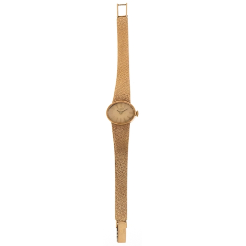 3035 - Tissot, a ladies 9ct gold Tissot manual wind wristwatch with 9ct gold strap, the case 21mm wide, tot... 
