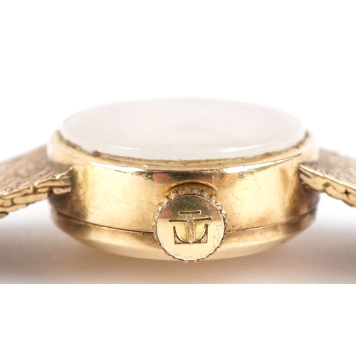 3035 - Tissot, a ladies 9ct gold Tissot manual wind wristwatch with 9ct gold strap, the case 21mm wide, tot... 
