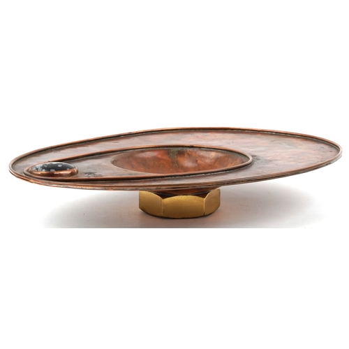 5 - Sam Fanaroff, an Arts & Crafts style abstract copper and brass centre bowl set with a black cabochon... 