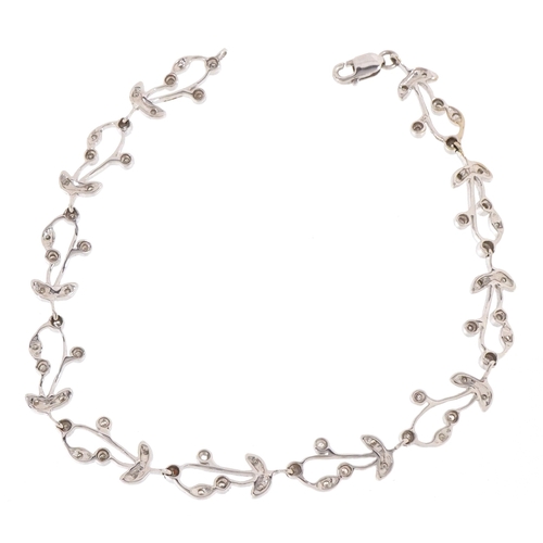 3032 - An unmarked white gold and diamond floral bracelet, 19cm in length, 6.0g.
