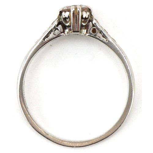 3003 - A platinum diamond solitaire ring with diamond set shoulders, the diamond approximately 4.89mm in di... 
