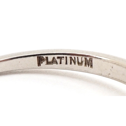 3003 - A platinum diamond solitaire ring with diamond set shoulders, the diamond approximately 4.89mm in di... 
