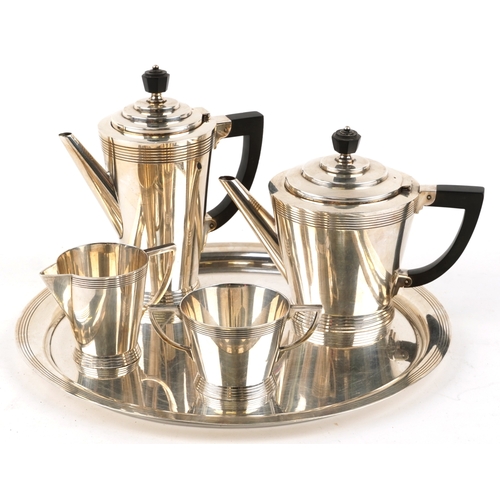 An Art Deco Mappin & Webb five piece plated coffee set designed by Keith Murray comprising coffee pot, teapot, milk jug, sugar bowl and circular tray, 35cm in diameter.