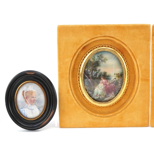 31 - A pair of 20th century oval hand painted porcelain panels, each decorated with two young women, each... 