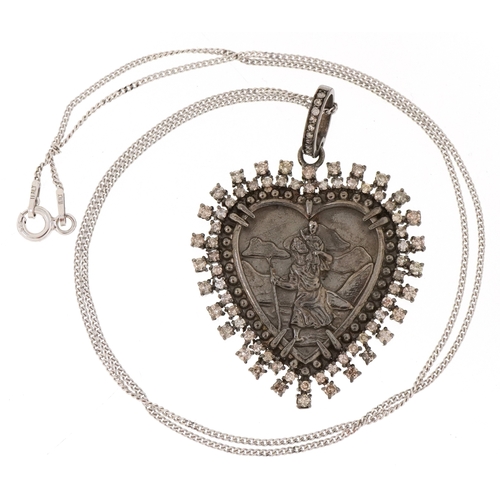 3022 - A silver and diamond St. Christopher pendant on a silver necklace, total diamond weight approximatel... 