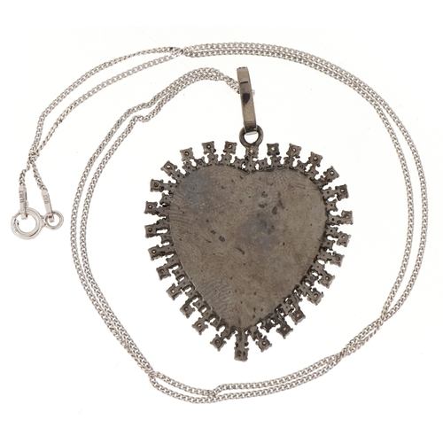 3022 - A silver and diamond St. Christopher pendant on a silver necklace, total diamond weight approximatel... 