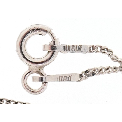 3022 - A silver and diamond St. Christopher pendant on a silver necklace, total diamond weight approximatel... 