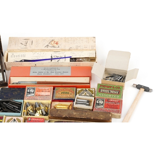 434 - A collection of early 20th century dip pen nibs including examples by William Mitchell, John Heath, ... 