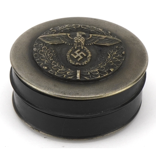A German military interest snuff box, 7cm in diameter.