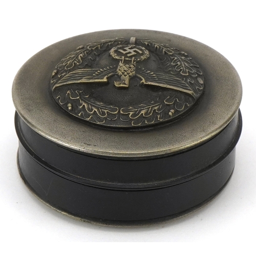 A German military interest snuff box, 7cm in diameter.