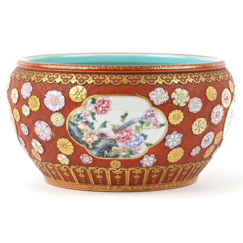 54 - A large Chinese porcelain jardinière, finely hand painted in the famille rose palette with panels of... 