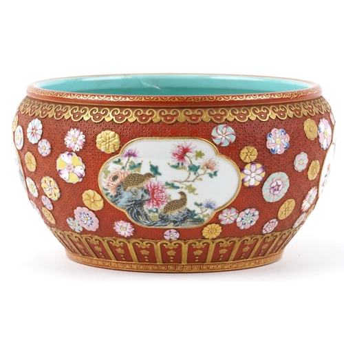 54 - A large Chinese porcelain jardinière, finely hand painted in the famille rose palette with panels of... 