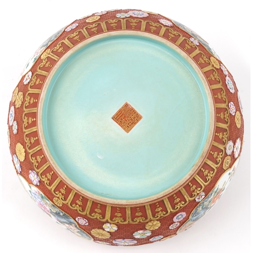 54 - A large Chinese porcelain jardinière, finely hand painted in the famille rose palette with panels of... 