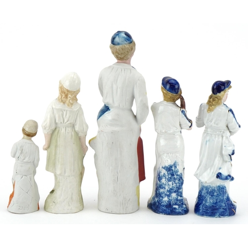 2498 - Various Victorian bisque figures of cricketers including a boy and girl couple, the largest 24cm hig... 