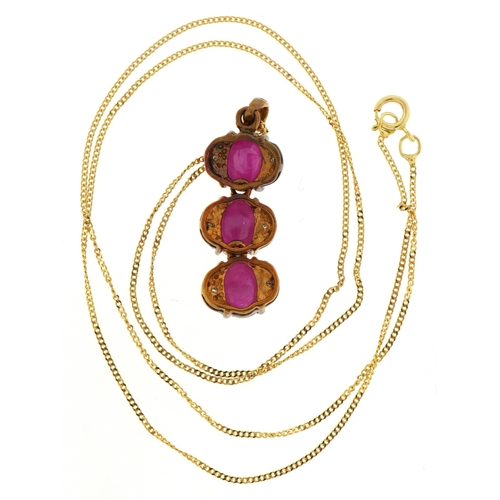 3034 - A 9ct gold cabochon ruby and diamond pendant on a 9ct gold necklace, 2.2cm high and 46cm in length, ... 