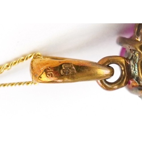 3034 - A 9ct gold cabochon ruby and diamond pendant on a 9ct gold necklace, 2.2cm high and 46cm in length, ... 