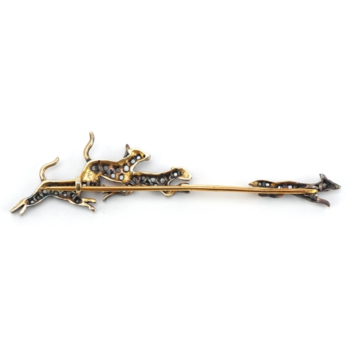 3005 - An antique unmarked gold diamond set fox and hounds bar brooch, 7cm in length, 4.0g.