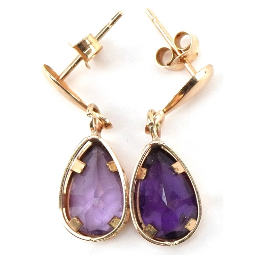 A pair of unmarked gold amethyst teardrop earrings, 1.8cm high, total 1.1g.