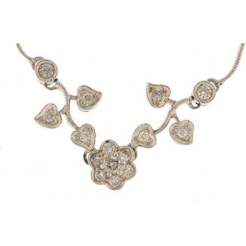 3010 - An 18ct white gold diamond floral necklace, the largest diamond approximately 0.12 carat, 35cm in le... 