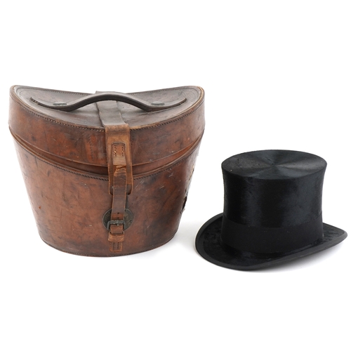 An early 20th century R. Forsyth moleskin top hat with leather case, the interior of the hat 19.5cm x 16.5cm.