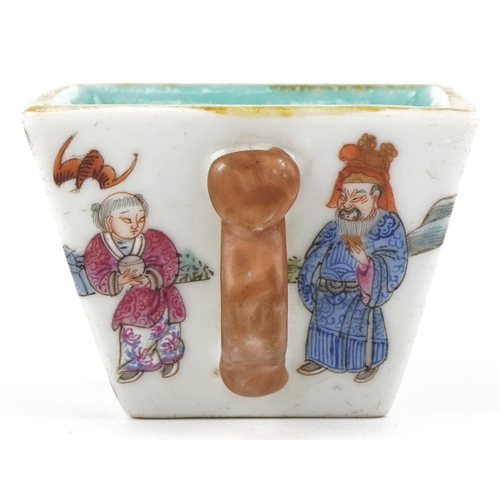 41 - A Chinese porcelain square section bowl with twin handles finely hand painted with enamels in the fa... 