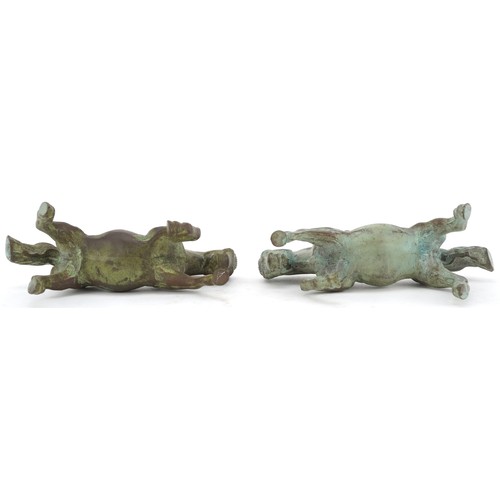 44 - A pair of Chinese patinated bronze figures of rearing horses on hardwood stands, each 20cm high.