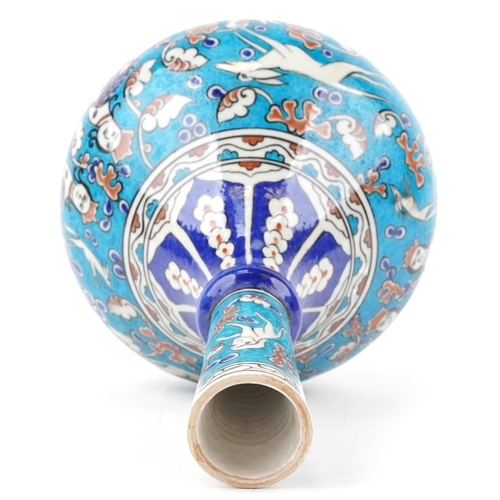 50 - A Turkish Ottoman Iznik vase hand painted with animals and stylized motifs, 41cm high.