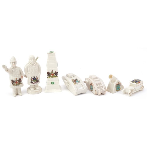 1260 - Seven military interest WWI crested china items comprising two figures, two tanks, a car, cannon and... 